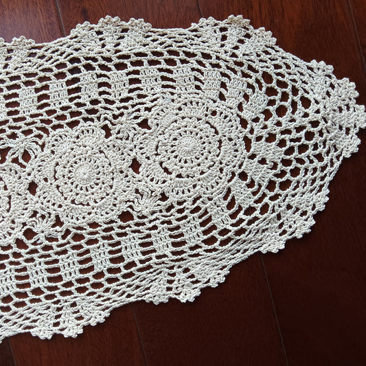 Flat-lay of a 100% cotton handmade crochet runner showing the soft texture and timeless beige palette.