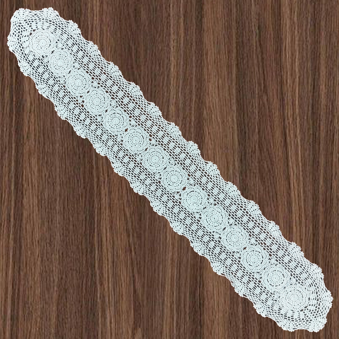12x63 inch White lace doily on a wooden surface