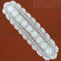 12x48 inch White lace table runner on a wooden surface