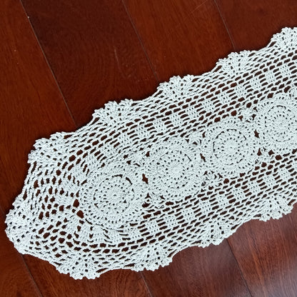White crocheted doily oval