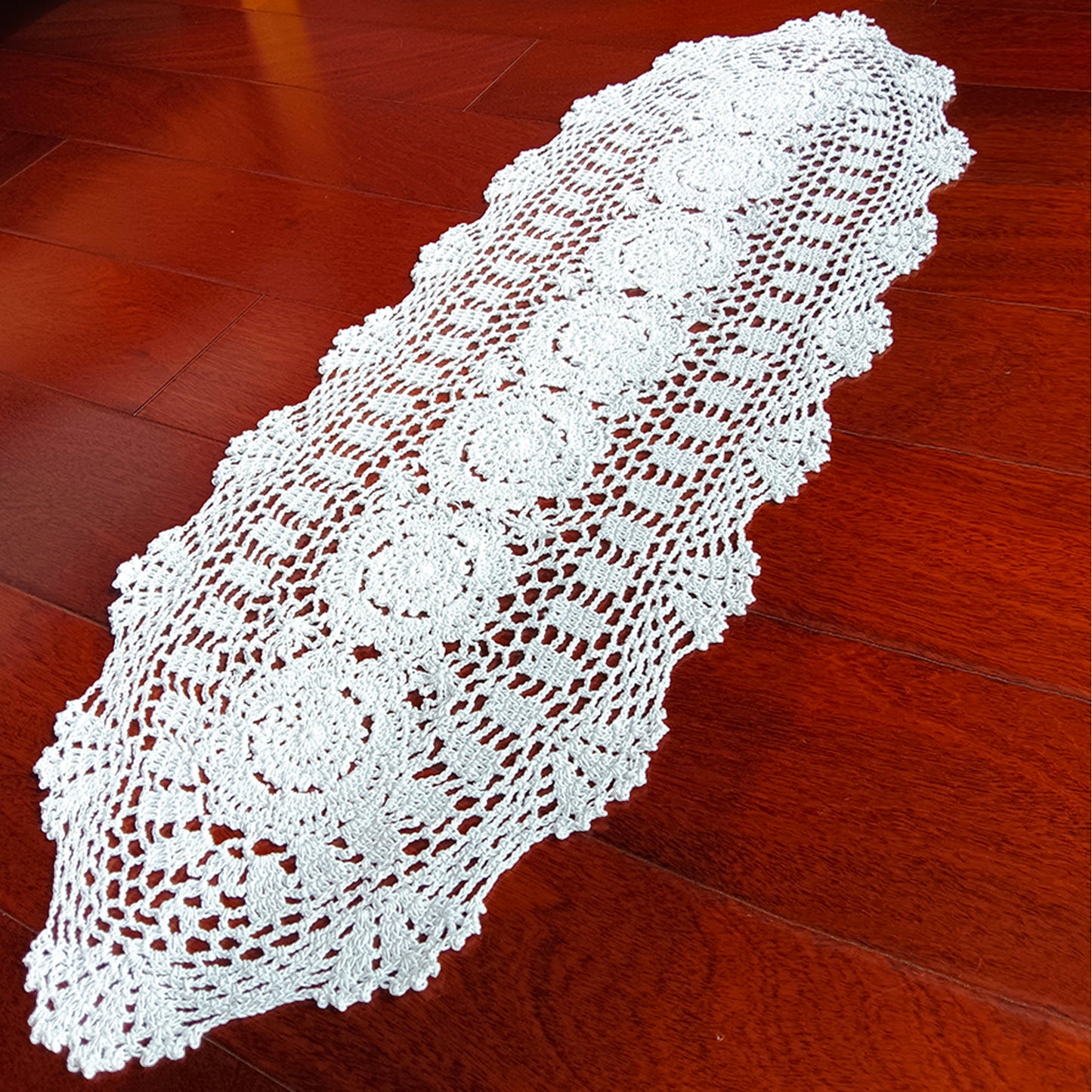 12x35 inch White lace tablecloth on a wooden floor